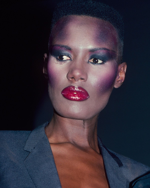 grace jones with bright pink lipstick 80s makeup trend